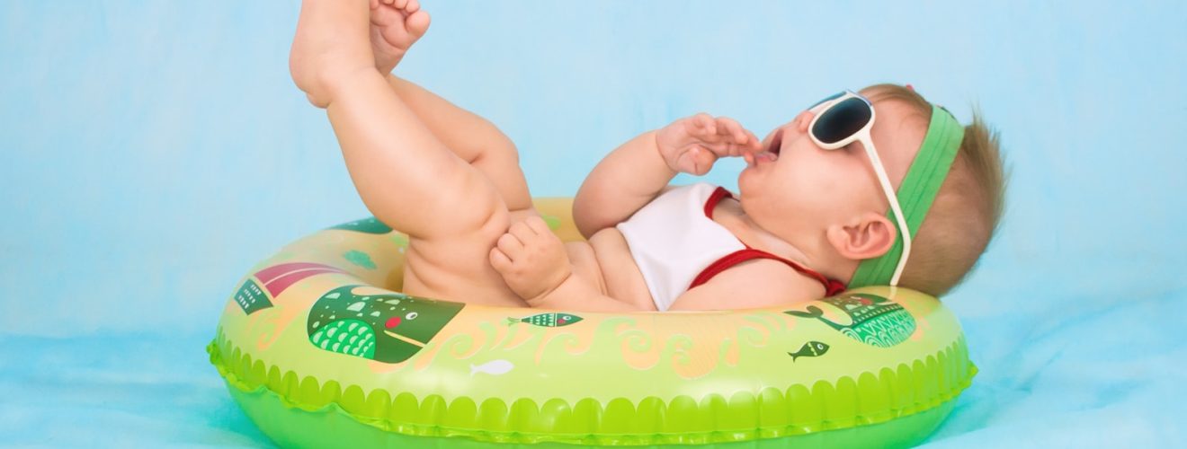 baby lying on inflatable ring