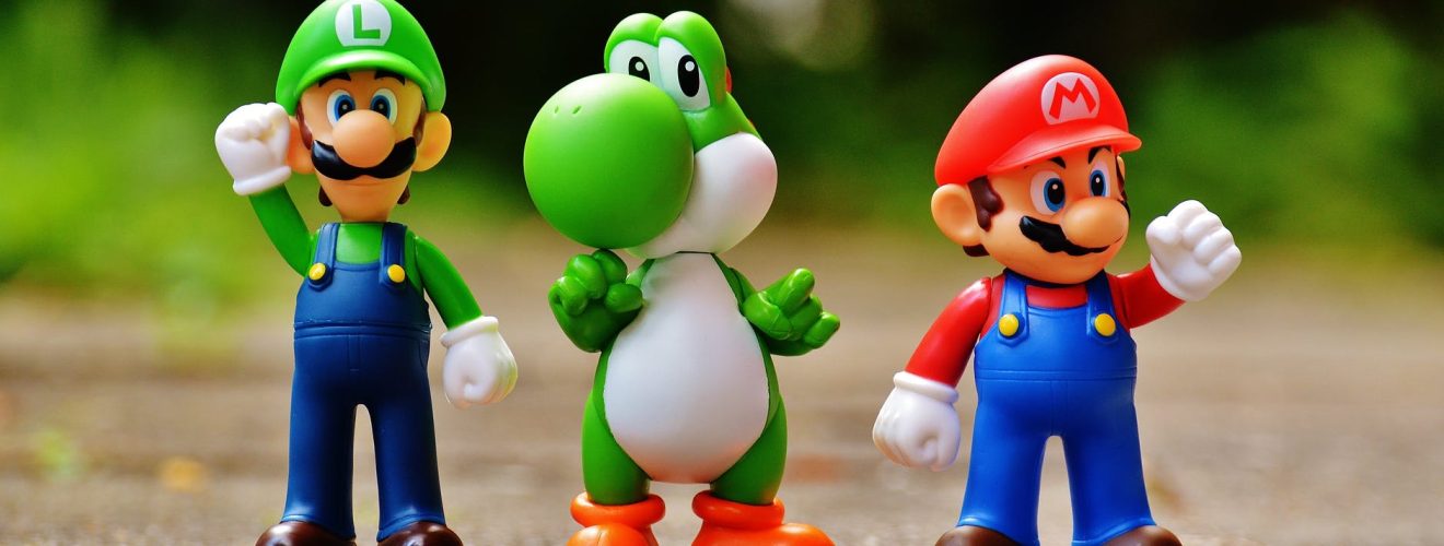 focus photo of super mario luigi and yoshi figurines