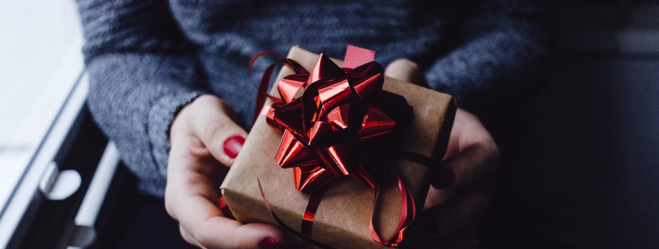 person holding present box