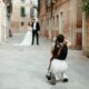 Photographer captures couple in a narrow venetian alleyway.